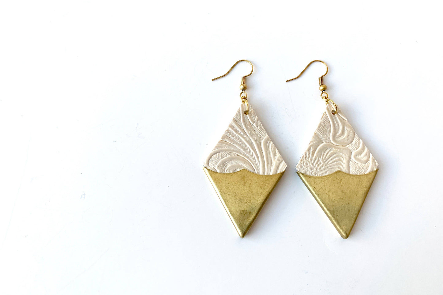 The SULTRY Leather Earrings by Lord Violet, diamond shaped gold-tipped up-cycled leather dangle earrings, are shown against a white background.