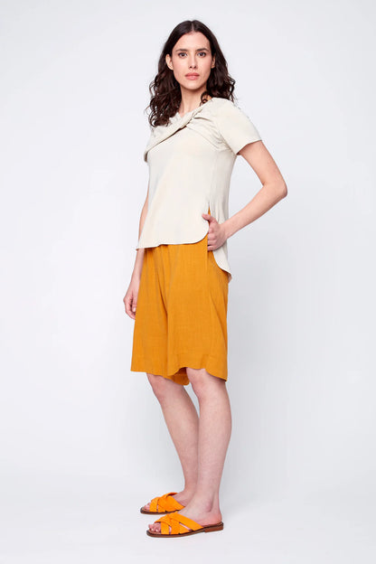 Monica Top by Julei, Oatmeal, draped bow at neckline with opening beneath, short sleeves, side slits, rounded hi-low hemline, eco-fabric, bamboo, cotton, sizes S and M, made in Montreal