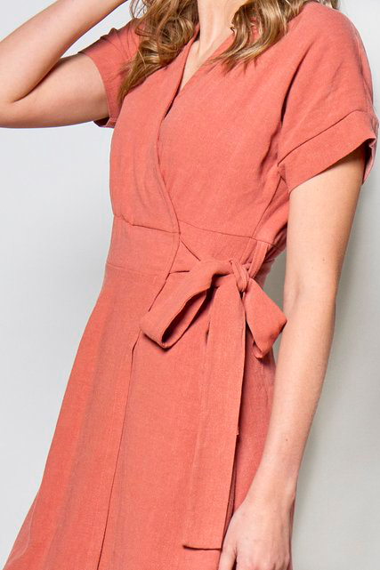 Maura Dress by Tangente, Coral, wrap dress, V-neck, short cuffed sleeves, attached tie belt, above the knee, hidden side pockets, eco-fabric, OEKO-TEX certified, viscose/linen, sizes XS to XXL, made in Ottawa 