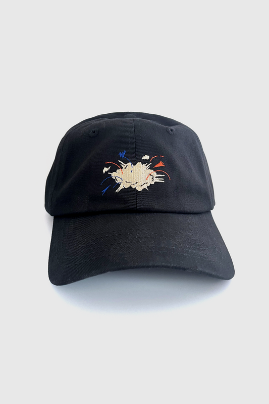 The Boom Boom Hat by Badaboöm Studio, featuring an embroidered graphic of an explosion on a black baseball cap, set against a light grey background.