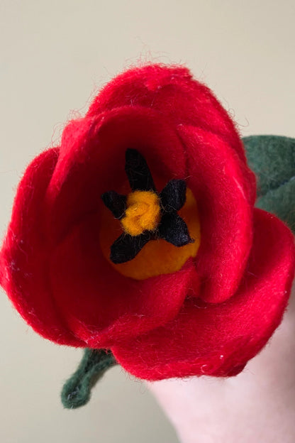 A close up detail of the Handmade Felt Tulip by ForgetBKnot. 