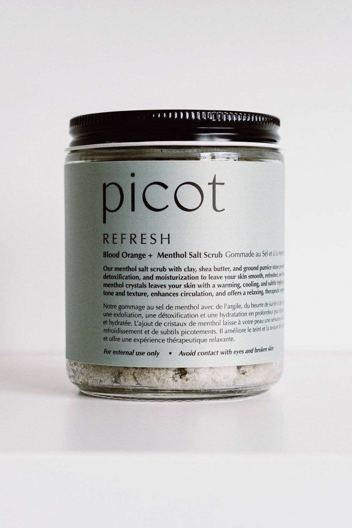 Jar of picot Refresh salt scrub on a white background