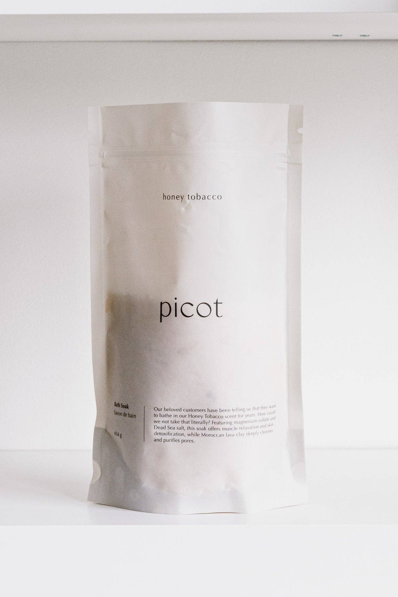White bag of Picot's Honey Tobacco bath soak, shown against a white background. 