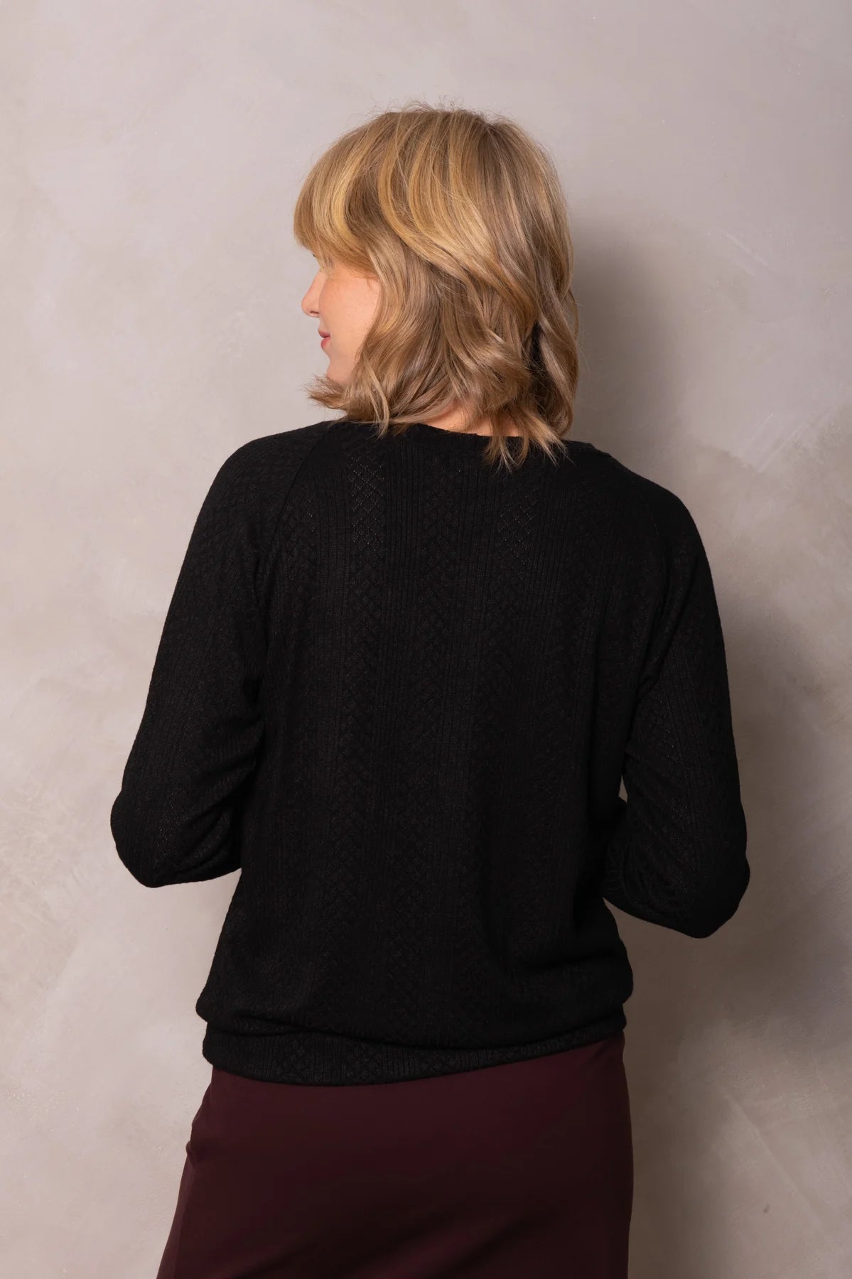 Rhea Sweater by Cokluch, Black, back view, textured knit, raglan sleeves, round neck, band at hem, bamboo rayon blend, sizes XS to 3XL, made in Quebec