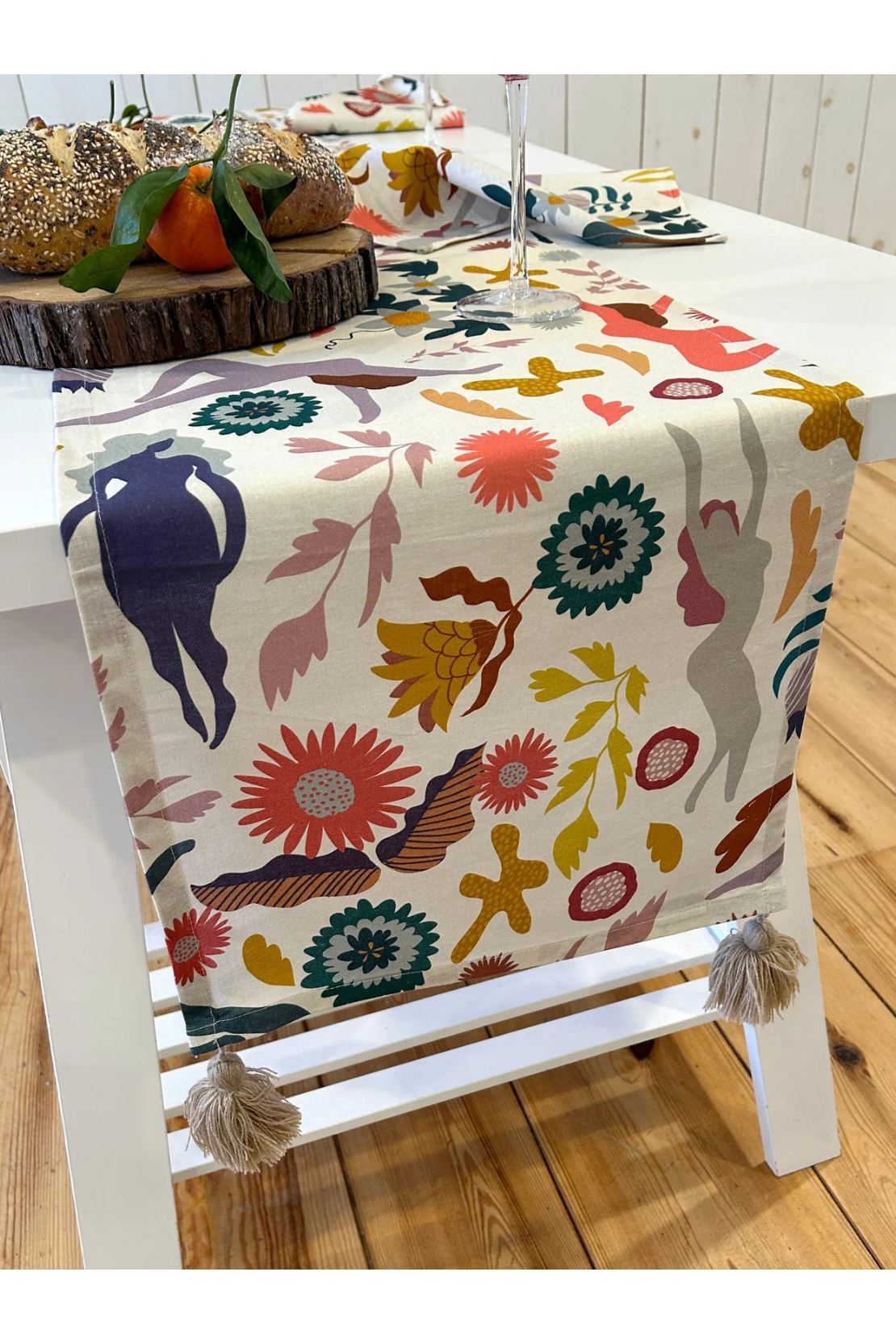 Stories Table Runner with Pompoms