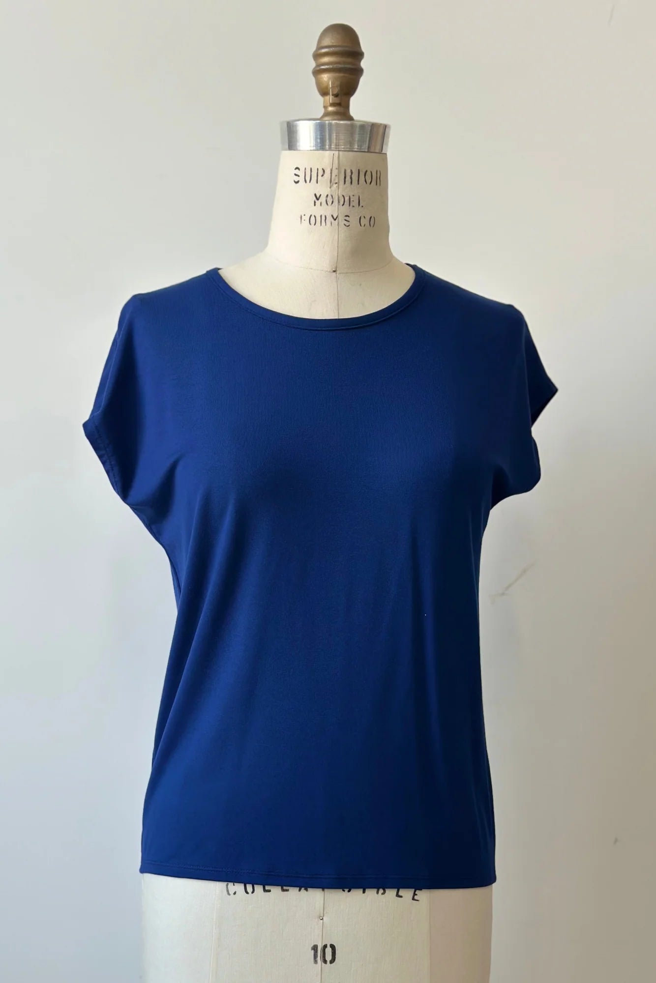 The Eowyn T-Shirt by Kollontai in Admiral is shown on a white mannequin against a white background.
