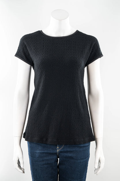 The Onyx T-Shirt by Karkass in Black, in a stretchy 3D textured fabric, is shown on a mannequin with a white background