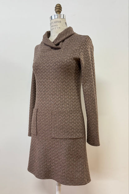 The Sacha Tunic by Kollontai in Brown, a textured knit straight cut tunic with a funnel collar and large patch pockets, is shown on a mannequin against a white background. 
