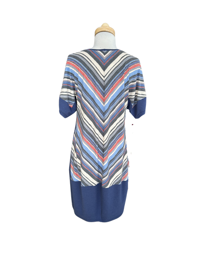 A back view of the Brianna Dress by Solomia is shown on a mannequin against a white background. 