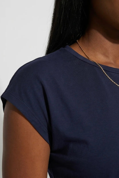 Close up detail of a woman wearing the Eowyn T-Shirt by Kollontai in Navy 