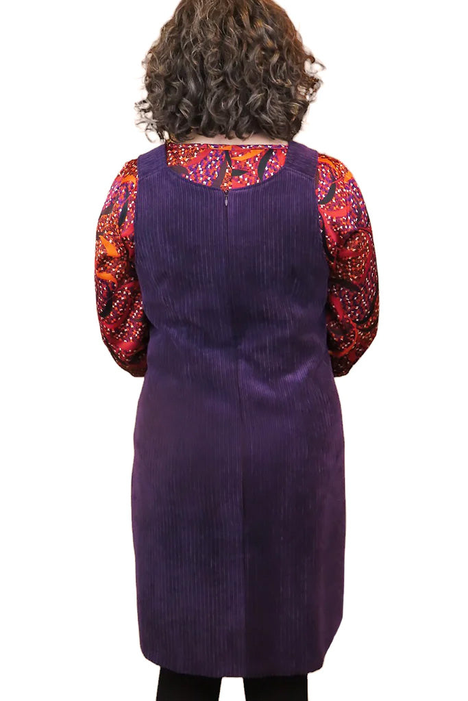 Joni Corduroy Jumper by Mandala, Purple, back view, V-neck, wide straps, decorative buttons, band at waist, hip pockets, sizes XS to XXL, made in Ontario