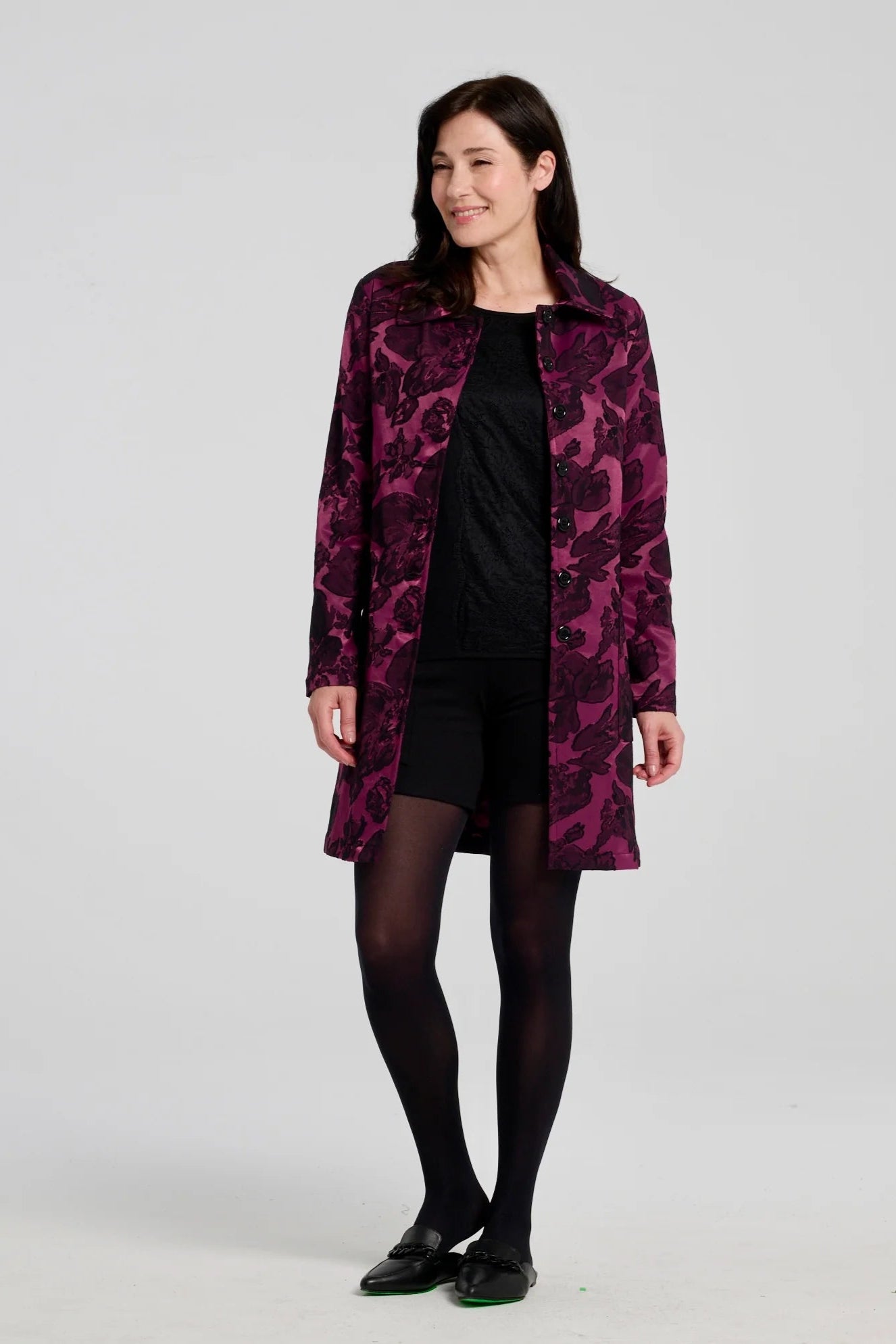 A woman wearing  the Amarante Coat by Kollontai