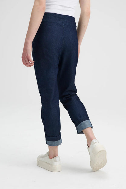 Back waist down view of a woman wearing the Potton Denim Pants by Message Factory, slim fitting jeans with a side zipper, with a white t-shirt, on a white background