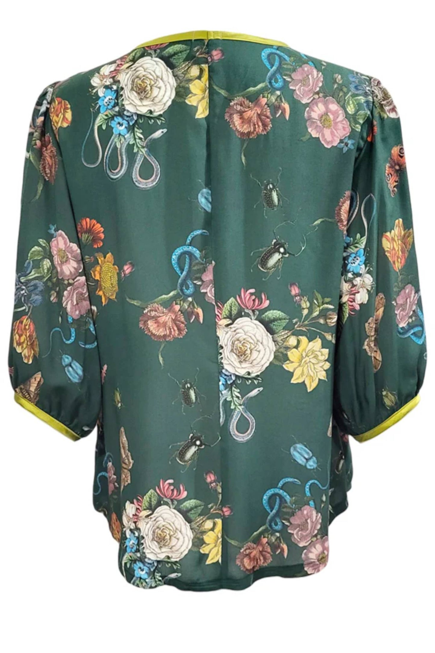 The back of the Lydia Creeper Blouse by Mandala in Forest is shown in front of a white background. It features a vintage floral print with snakes and insects, with a jewel neck, puffed 3/4 sleeves, and a scooped hem. 