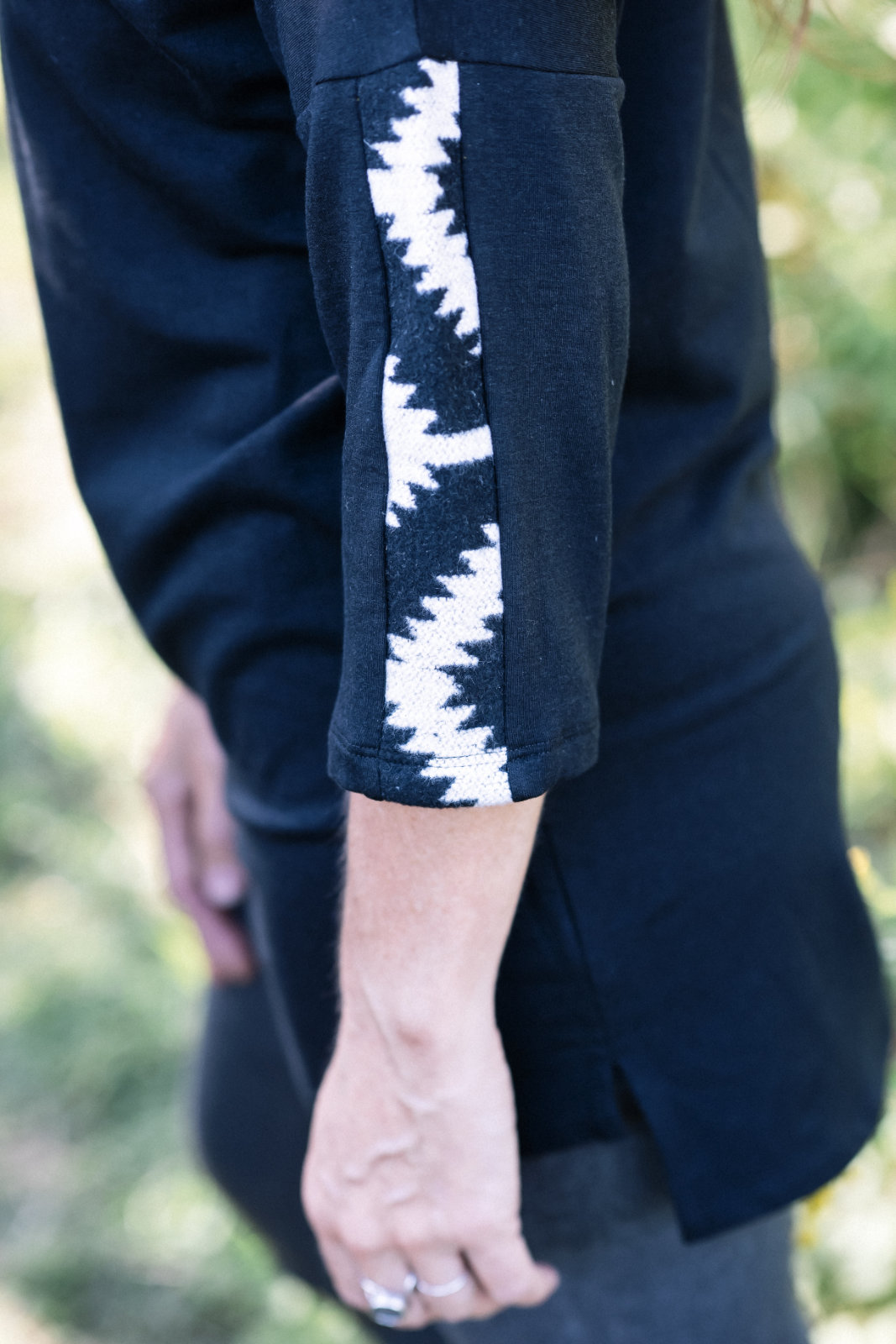 Close up detail of the sleeve fabric of the Marie C Tunic Java in Black 