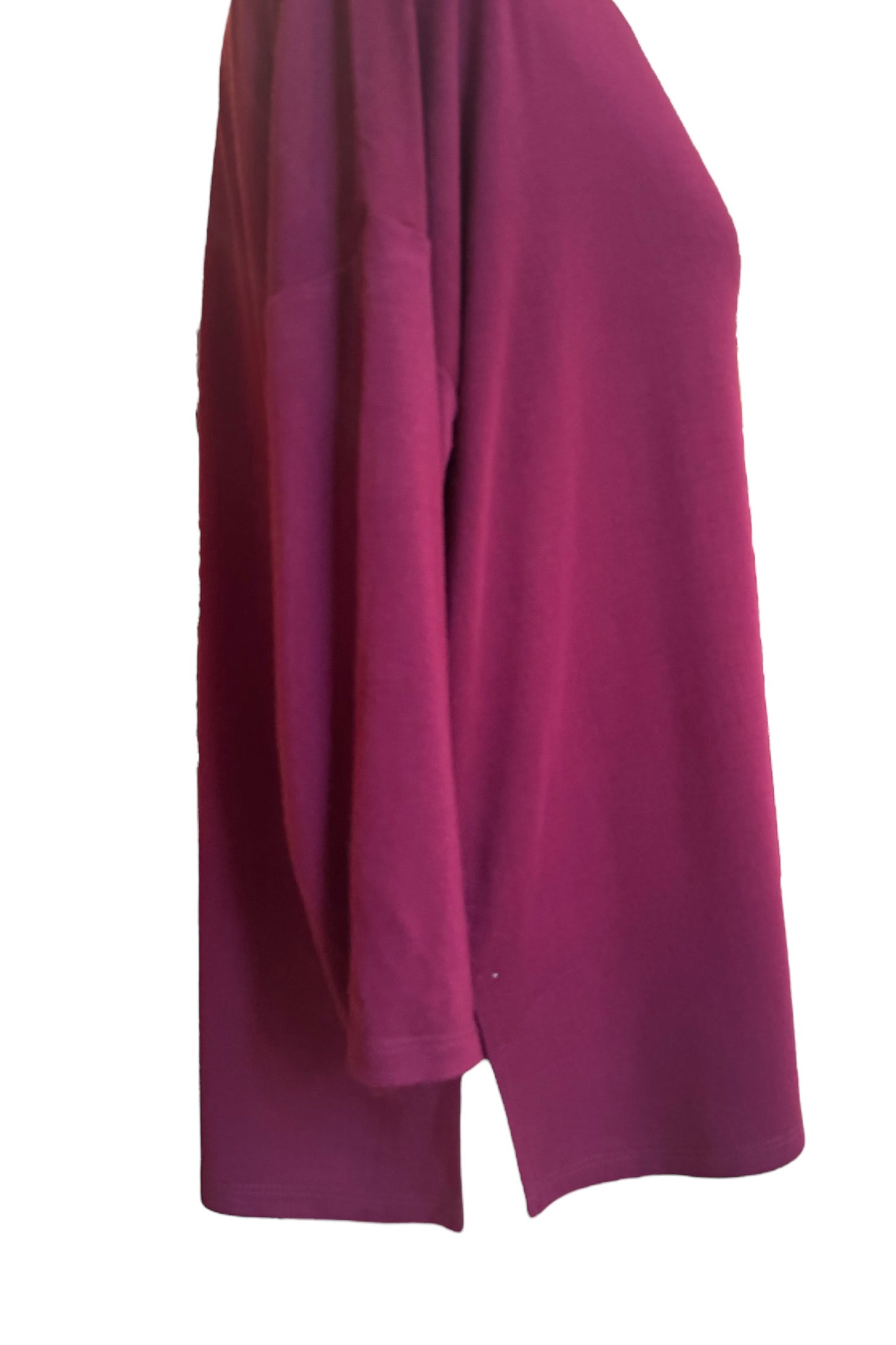A side view of the Emmy Top by Moovment in Burgundy, with a boat neck, 3/4 sleeves, and side slits, is shown on a mannequin in front of a white background. 