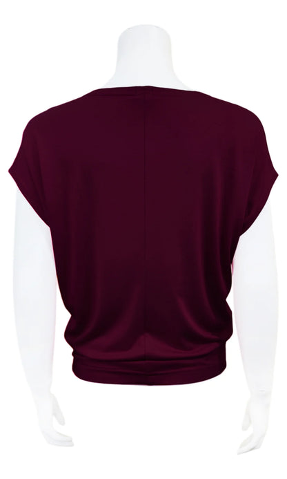A back view of the Mandala Charlie Slouch Tee in Blackberry is shown on a mannequin against a white background. 