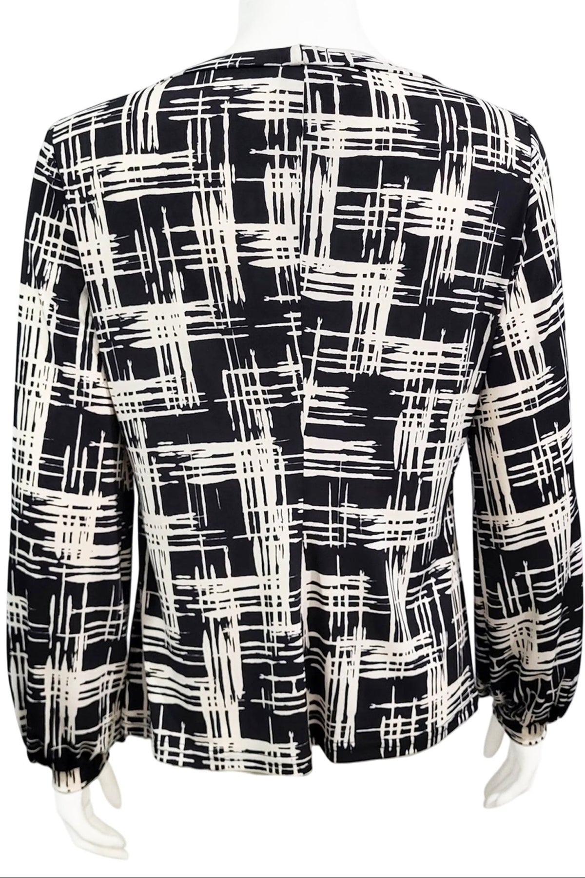 A back view of the Gwen Blouse by Mandala in Hopscotch - Black print is shown on a mannequin against a white background.