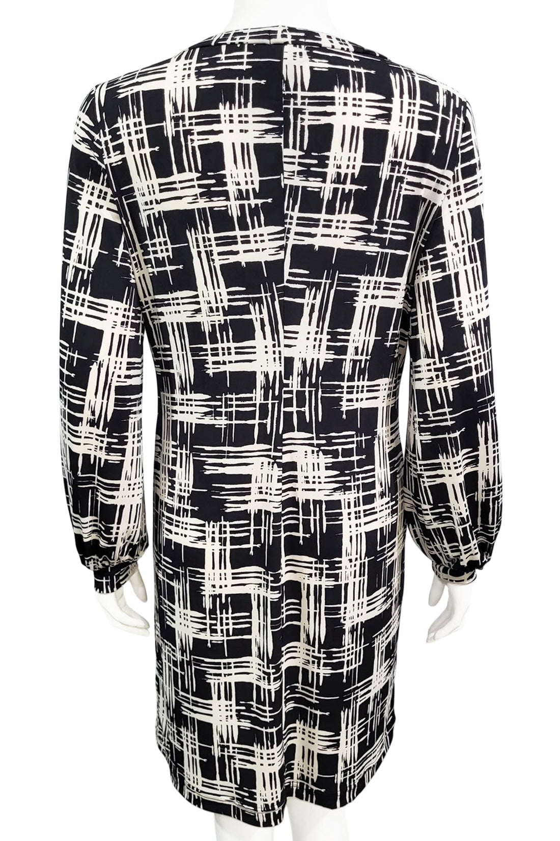 A back view of the Gwyneth mini dress from Mandala in Hopscotch - Black is shown on a mannequin against a white background 