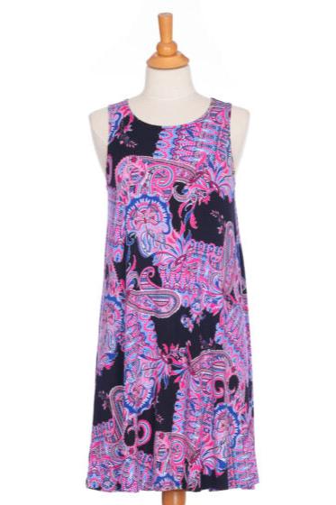 The Musette Dress by Rien ne se Perd, a short sleeveless swing dress with a purple Paisley print, shown on a mannequin in front of a white background. 