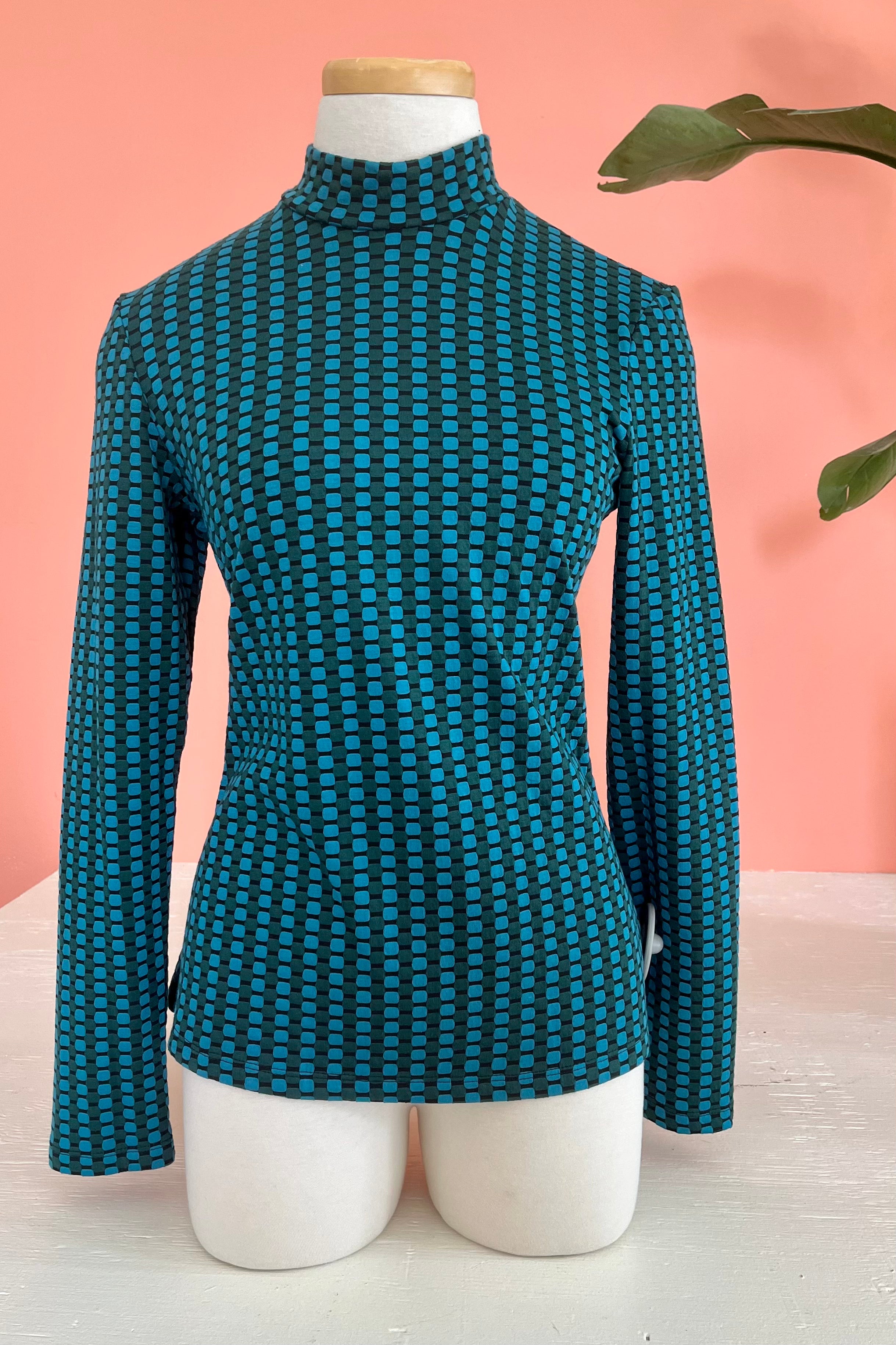 Paola Mock Top by Luc Fontaine, Turquoise, textured and patterned fabric, mock turtleneck, long sleeves, sizes 4-16, made in Canada