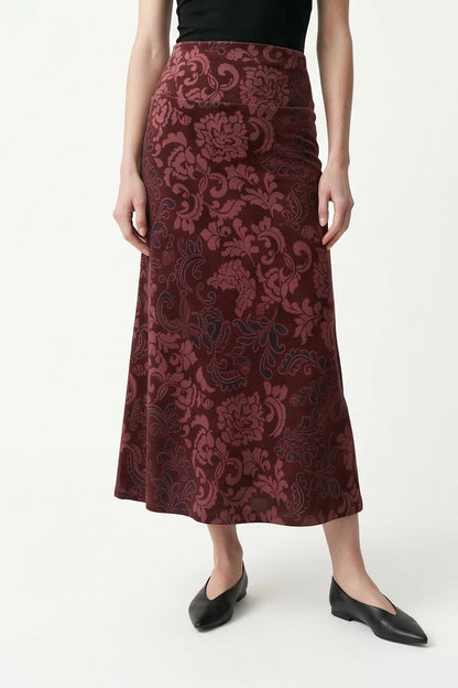 The Kollontai Winslet skirt, a burgundy velvet midi skirt, is shown on a mannequin against a white background. 