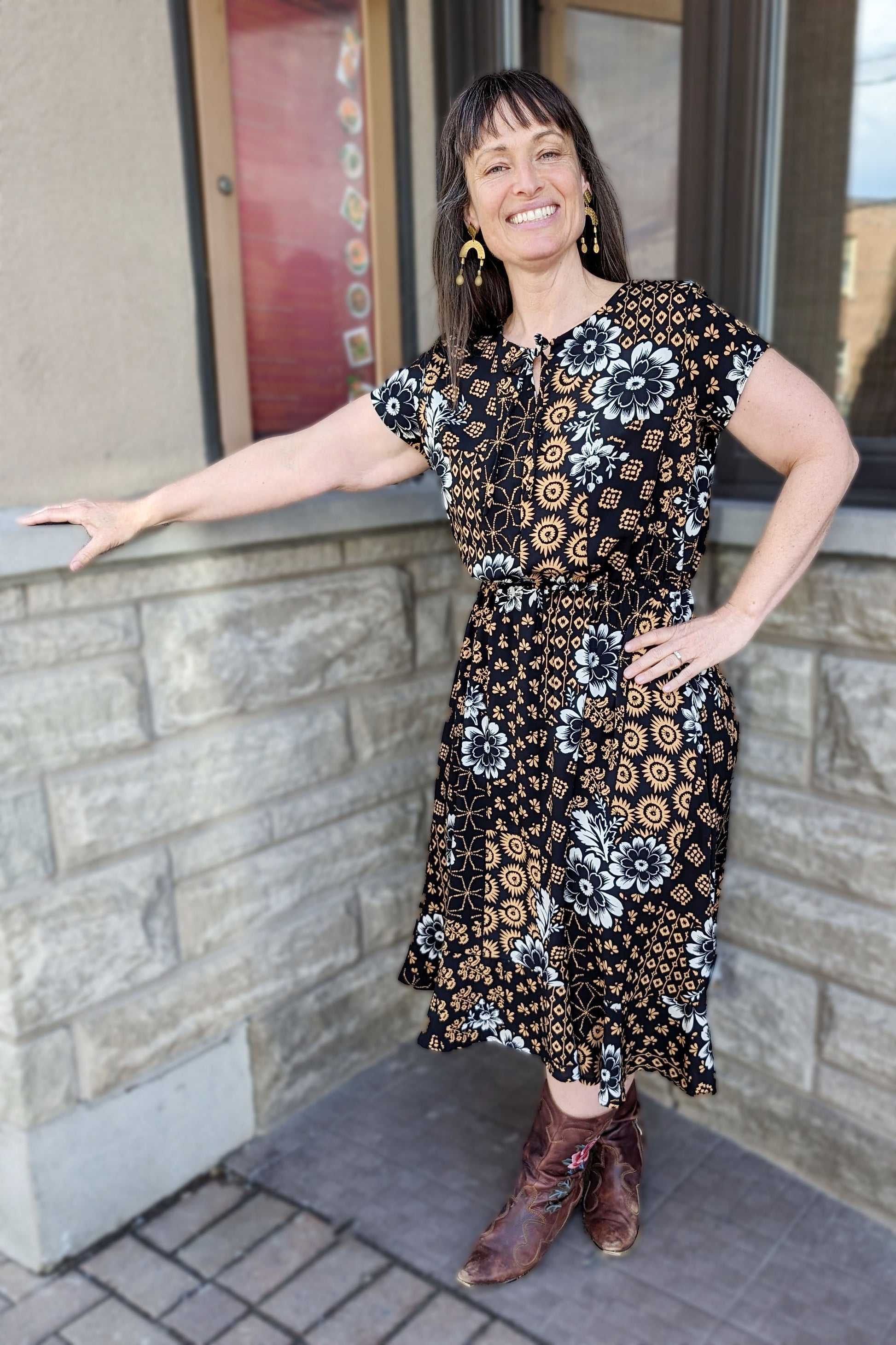 Aurore Dress by Cherry Bobin, Sand/White floral on black background, short sleeves, round neck with cut-out and tie detail, elastic waist, below the knee, sizes XS to L, made in Montreal
