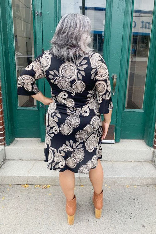 Sycamore Knit Dress by Compli K, Oat Paisley, back view, scoop neck, 3/4 flounce sleeves, flounced hem, sizes XS to XXL, made in Canada