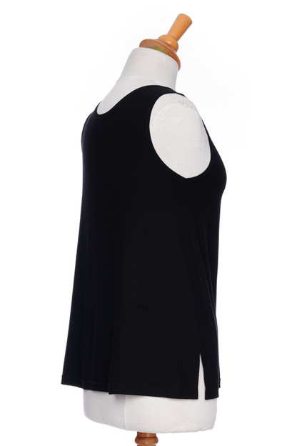 A side view of the Spritz Tank Top by Rien ne se Perd in Black, with wide straps and side slits, is shown on a mannequin in front of a white background 