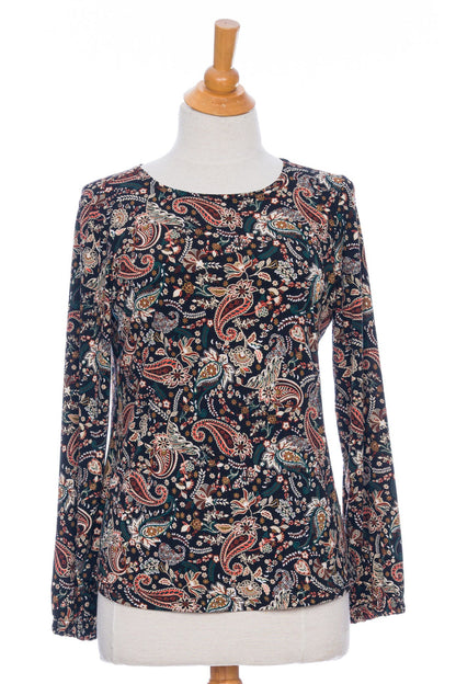 The Bruyère Sweater by Rien ne se Perd in Autumn Paisley print, with a round neck, relaxed fit, and long sleeves with cinched cuffs, is shown on a mannequin in front of a white background. 