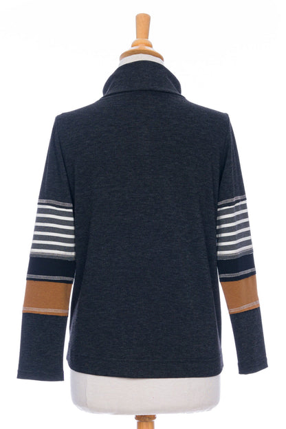 A back view of the Chicouté Sweater by Rien ne se Perd in Charcoal/Cognac, with a small turtleneck colour-blocked sleeves, is shown on a mannequin in front of a white background 