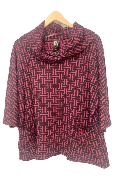 The Francis Tunic by Pure in Rosewood geometric print, featuring a turtleneck, 3/4 sleeves and two patch pockets, is shown hanging in front of a white wall. 