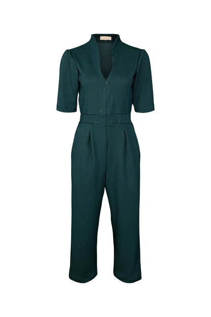 The Lexie Jumpsuit by Melow in Petrole (Teal) featuring short sleeves, a V-neck, invisible front zipper, elastic waist, and 34/ length legs in a diagonal stripe fabricm, is shown against a white background. 