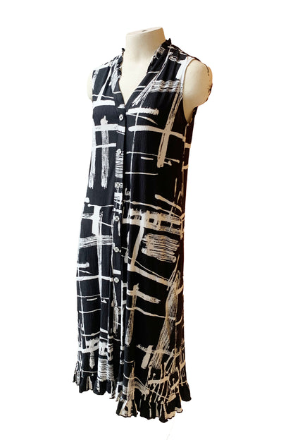 The Cordelia Dress by Pure Essence in Black/White Print is shown on a mannequin in front of a white background 