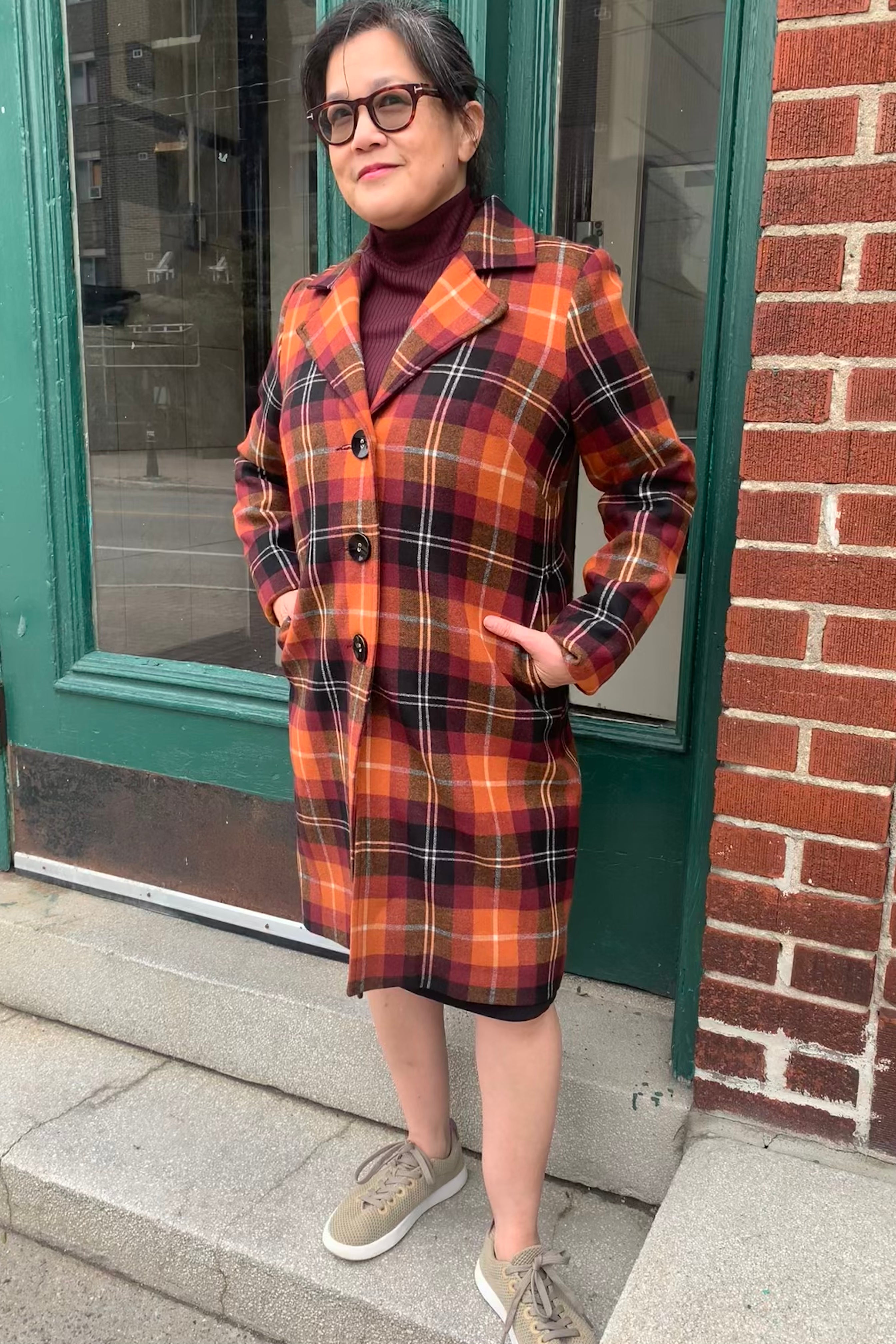 Sybille Coat by Luc Fontaine, Orange, wide lapels, buttons up the front, pockets, above the knee, sizes 4-16, made in Canada
