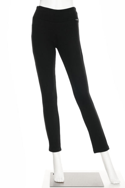 The Lichen Pant by Rien ne se Perd in Black, skinny leg pull-on pants in stretchy corduroy fabric, is shown on a mannequin in front of a white background. 
