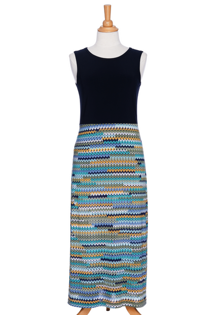The Mimosa Dress by Rien ne se Perd in Navy/Mesh print, a sleeveless 7/8 length dress with a solid navy top and a straight skirt with a mesh print in blue tones, is shown on a mannequin against a white background. 