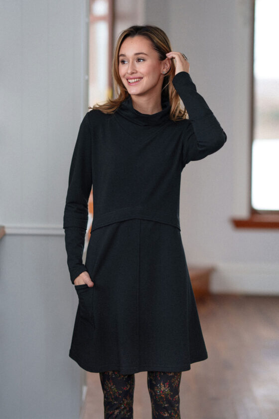 3/4 shot of a woman wearing the Suzor Tunic Dress by Rien ne se Perd in Black