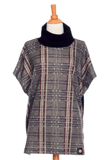 The Borduas Tunic-Poncho by Rien ne se Perd in Checkered print is show on a mannequin in front of a white background