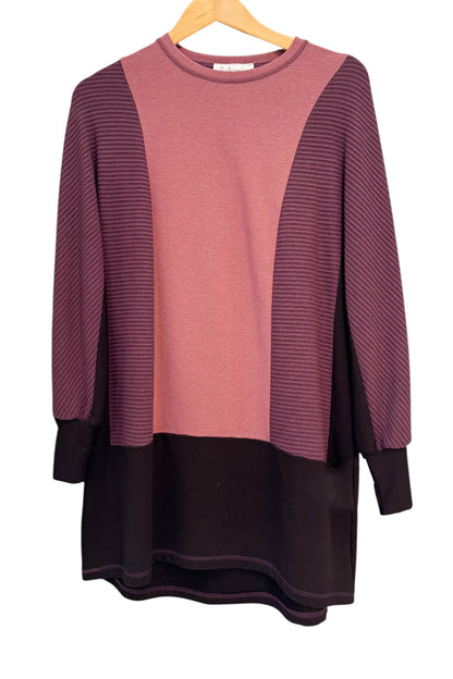The Viola Tunic by Solomia in Burgundy/Black/Old Rose, a colour-blocked piece featuring long,  a round neckline, and a mid-thigh length, is shown against a white background. 