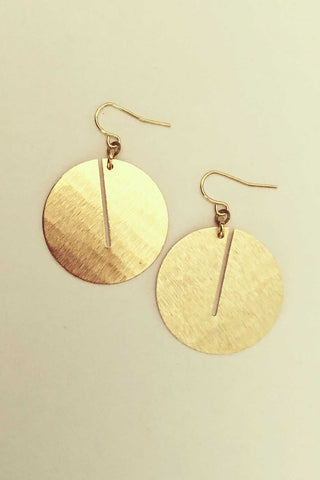 Eghah Earrings by Darlings of Denmark, brushed raw brass, circular dangle, circles with slits, made in Montreal