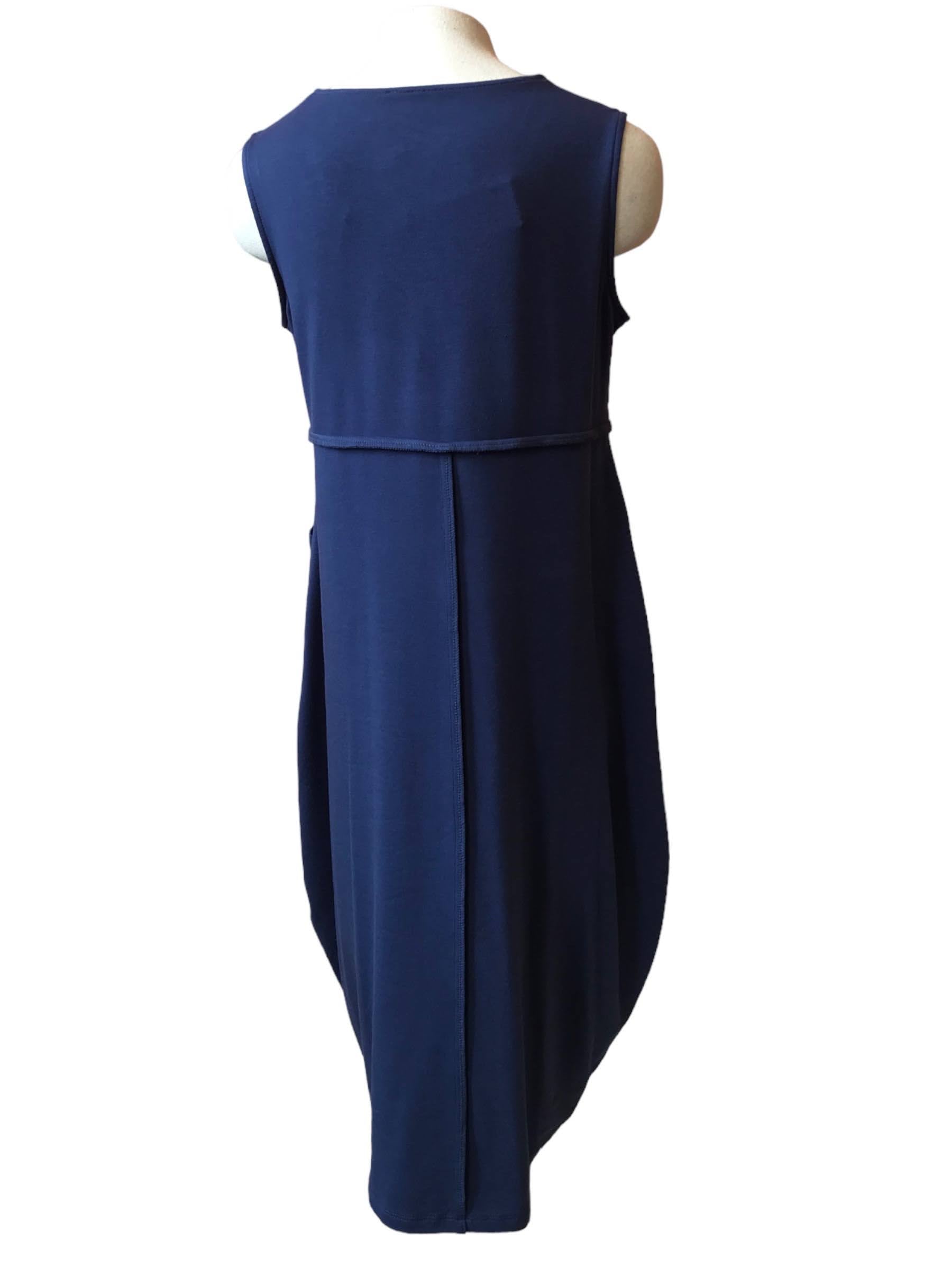 Wanda Dress by Pure Essence, Denim, back view, V-neck, sleeveless, vertical seams, asymmetrical horizontal seams, patch pockets, rounded hem, mid-calf length, eco-fabric, bamboo rayon, cotton, sizes XS to XXL, made in Canada