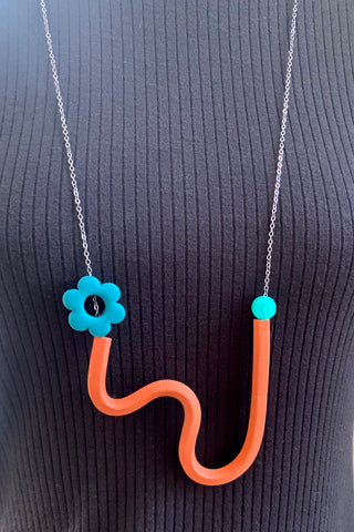 Terracotta Squiggle Necklace with Peacock Flower and transparent teal beads